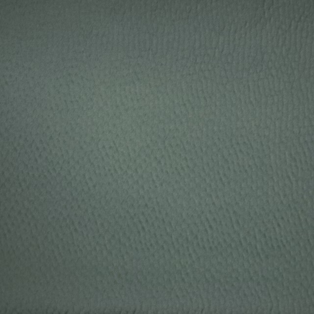 Muted peacock green woven fabric with a fine textured surface
