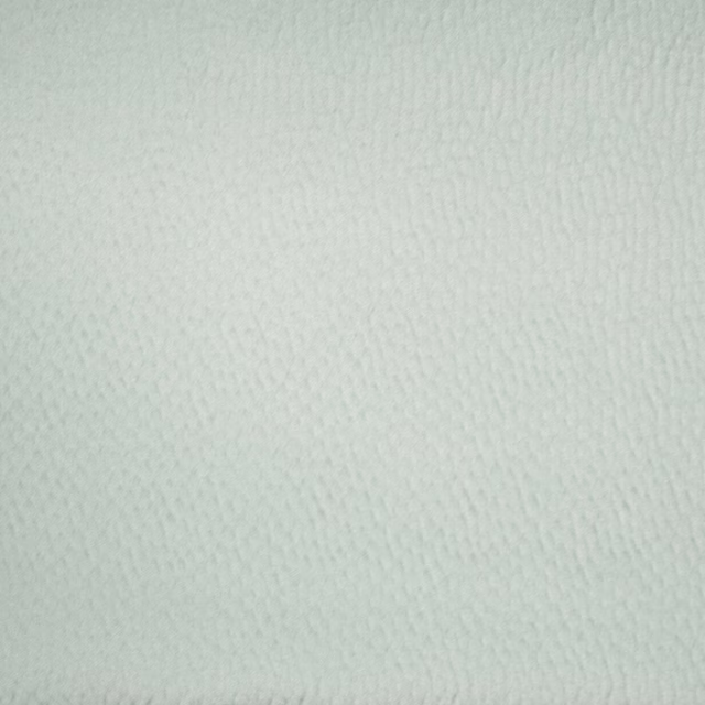 Pale spa green textured fabric swatch with a soft matte weave