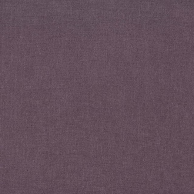 Close-up of a muted aubergine plain weave fabric with a soft matte finish