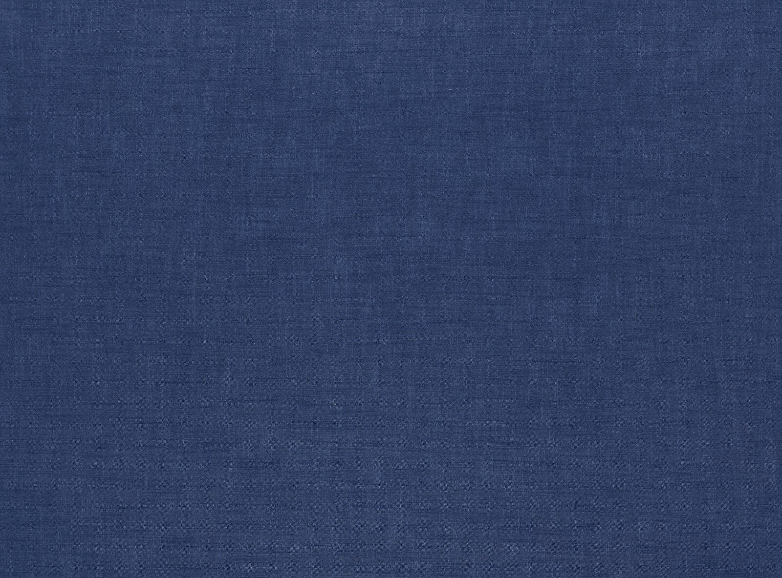 Muted denim-blue plain woven fabric with a soft matte, lightly slubbed texture