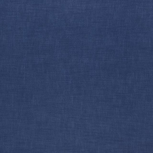 Muted denim-blue plain woven fabric with a soft matte, lightly slubbed texture