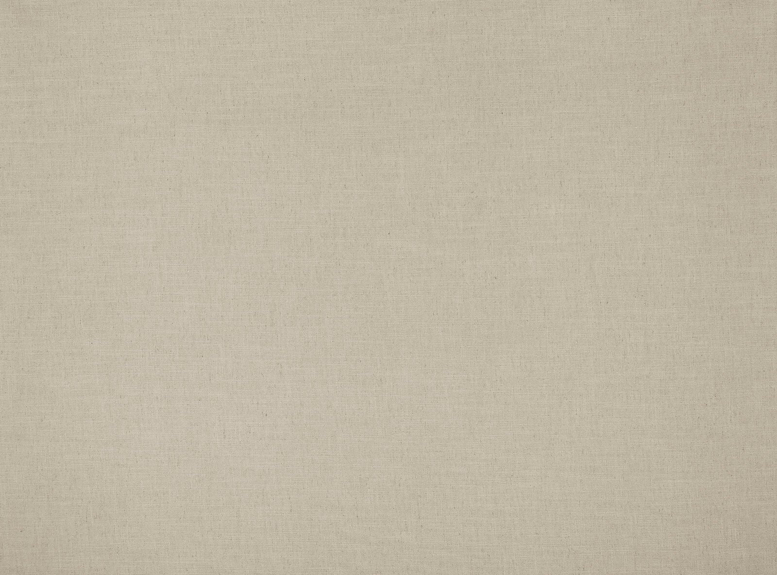 Close-up of a warm beige plain woven fabric with a fine matte texture
