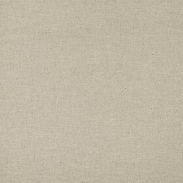Close-up of a warm beige plain woven fabric with a fine matte texture