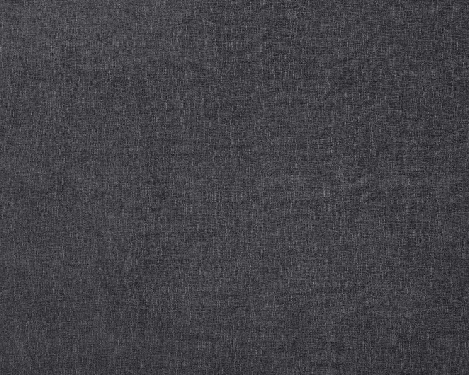 Close-up of deep charcoal grey plain woven fabric with fine texture