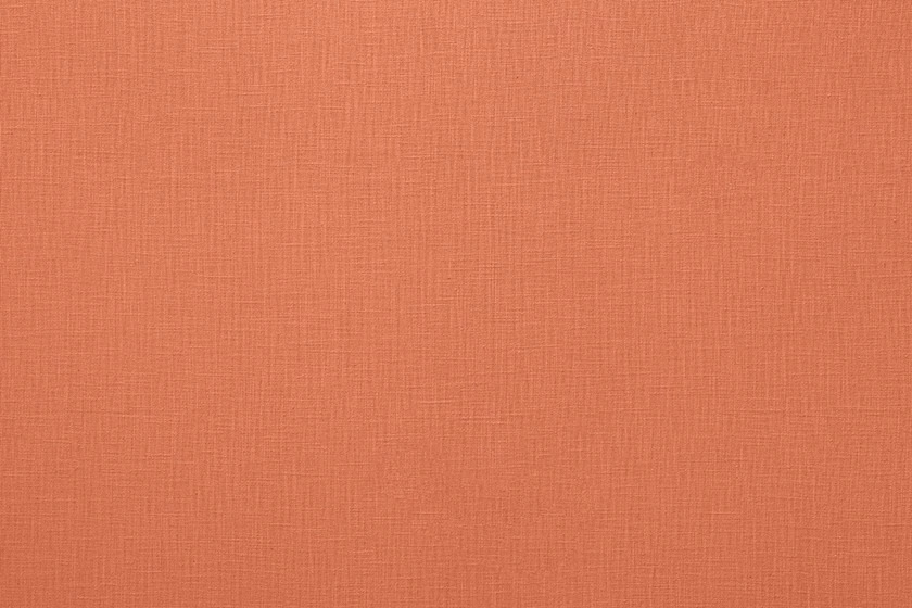 Warm coral plain weave fabric with a subtle linen texture