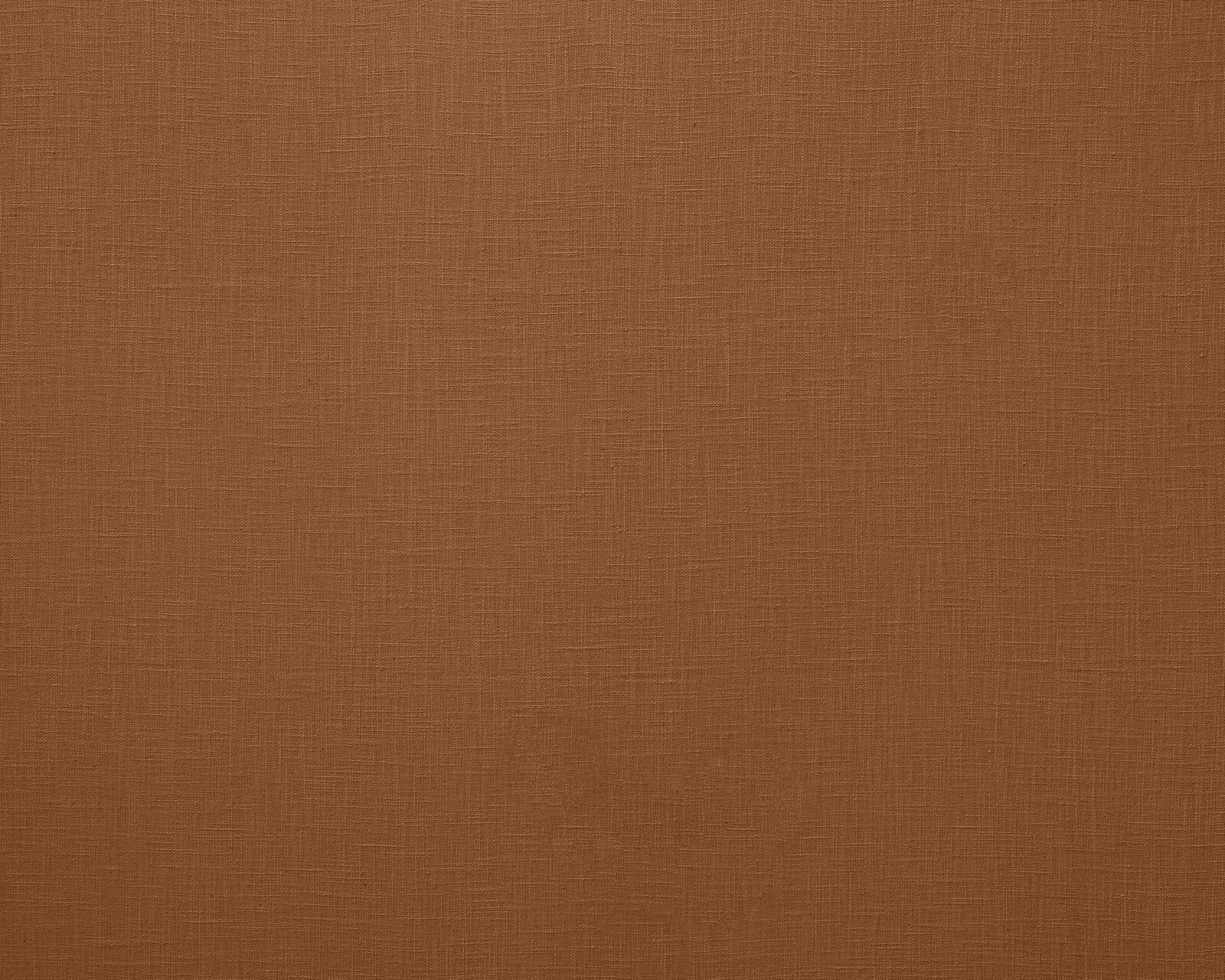 Warm rust-brown plain woven fabric with a fine linen texture