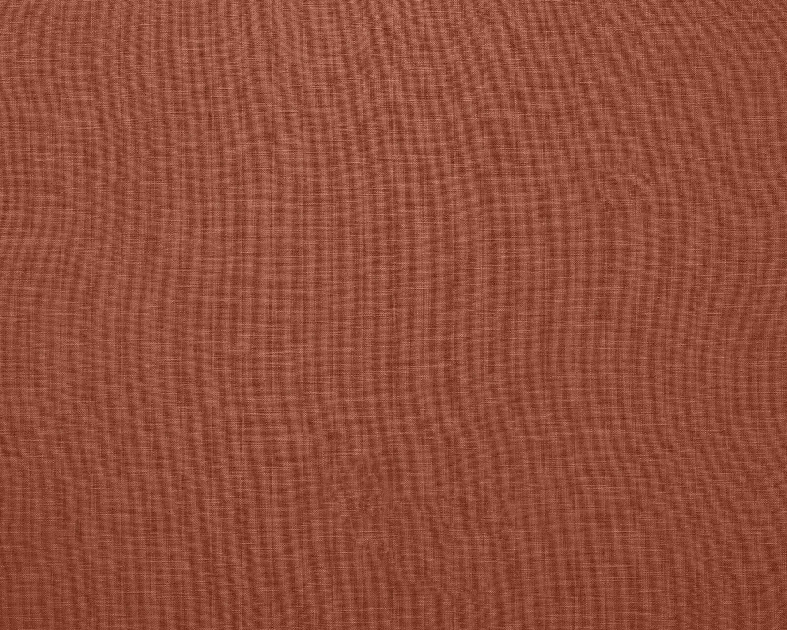 Warm terracotta plain weave fabric with fine linen texture
