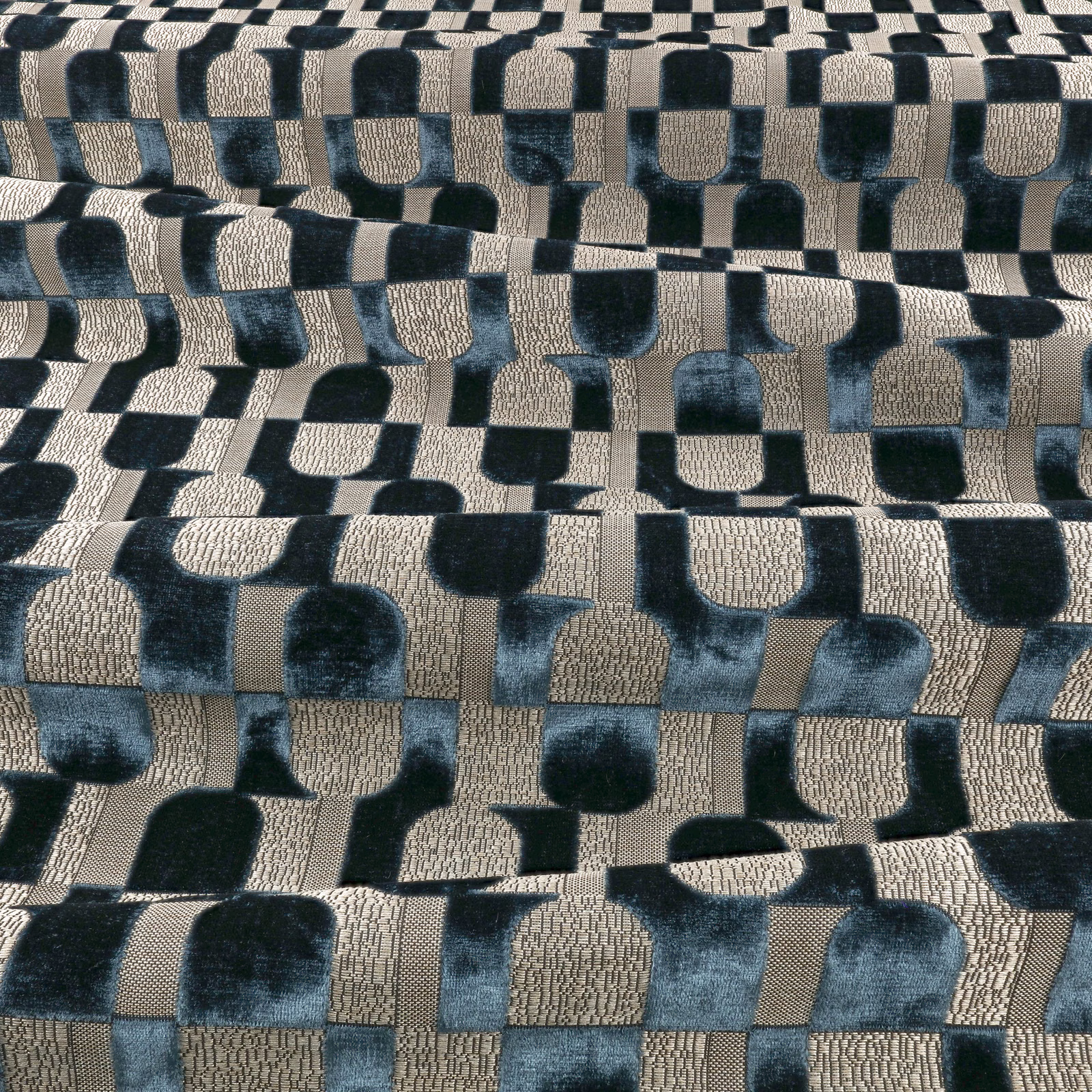 Ink-blue, black and oatmeal geometric blocks with a plush, textured woven surface