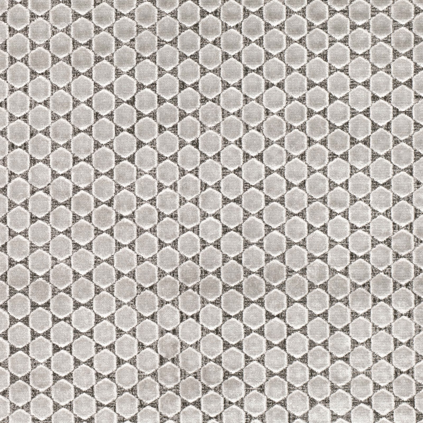 Close view of pale feather-grey geometric weave with rounded motifs and mottled texture
