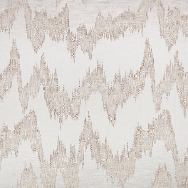 Ivory woven fabric with softly taupe jagged ikat motifs and visible texture