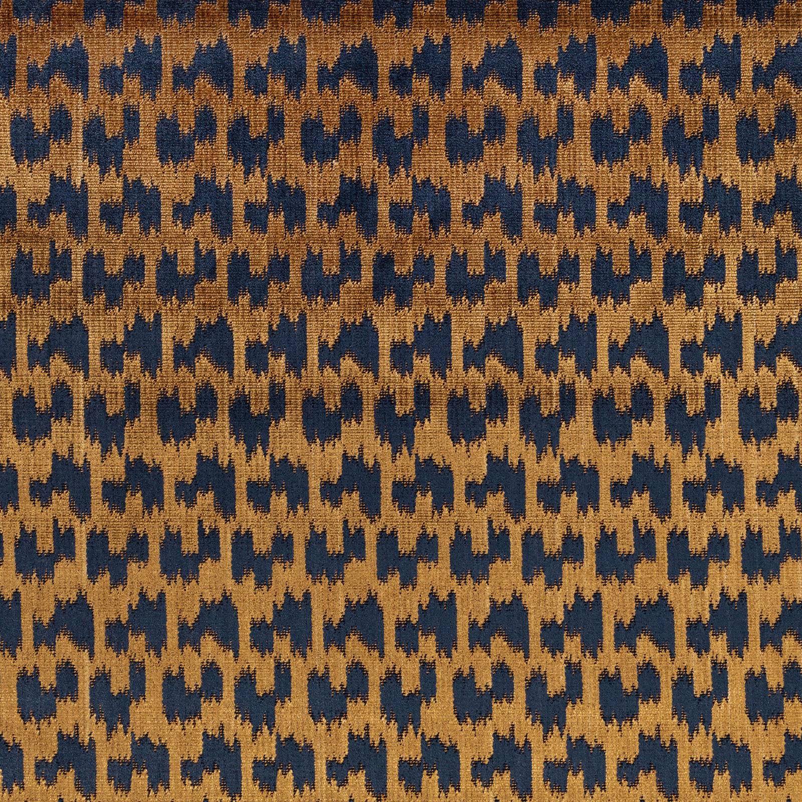 Ochre and deep navy jagged geometric weave with a tactile, broken surface