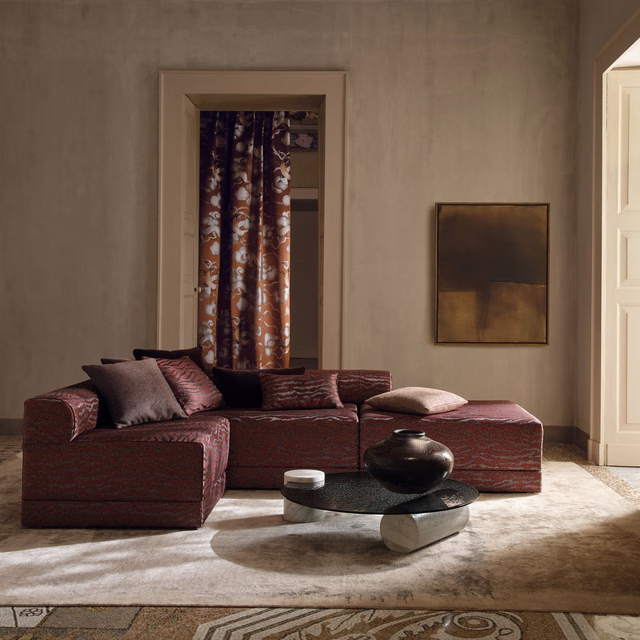 Deep burgundy-brown striated upholstery fabric covering a contemporary modular sofa
