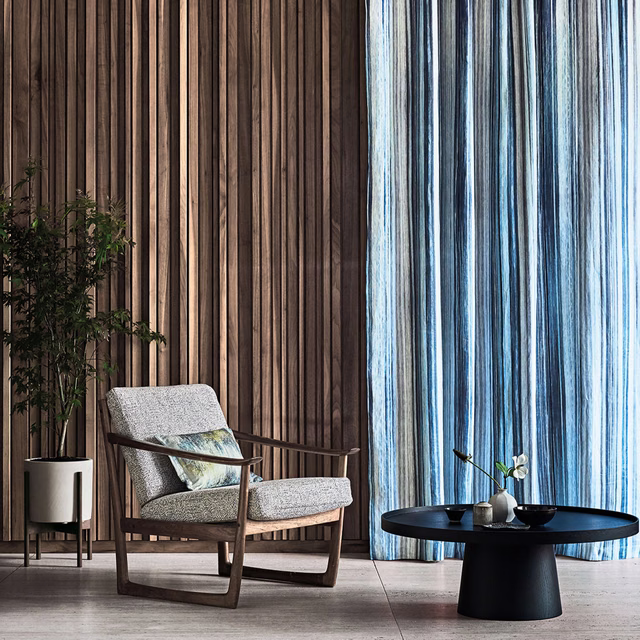 Cool zaffre-blue curtain with pale vertical streaks and deep charcoal lines