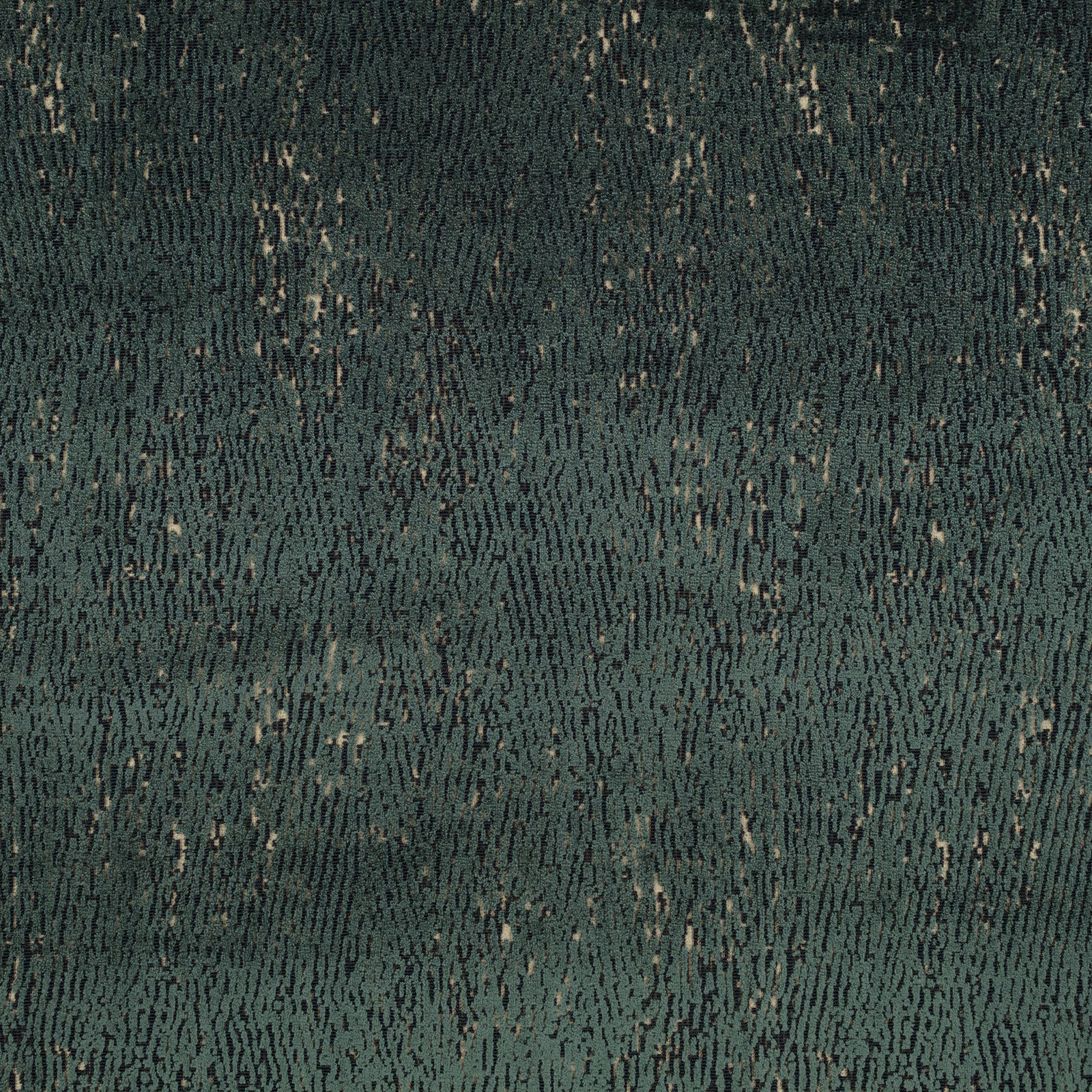 Close view of dark teal woven ground with irregular pale flecks and vertical texture