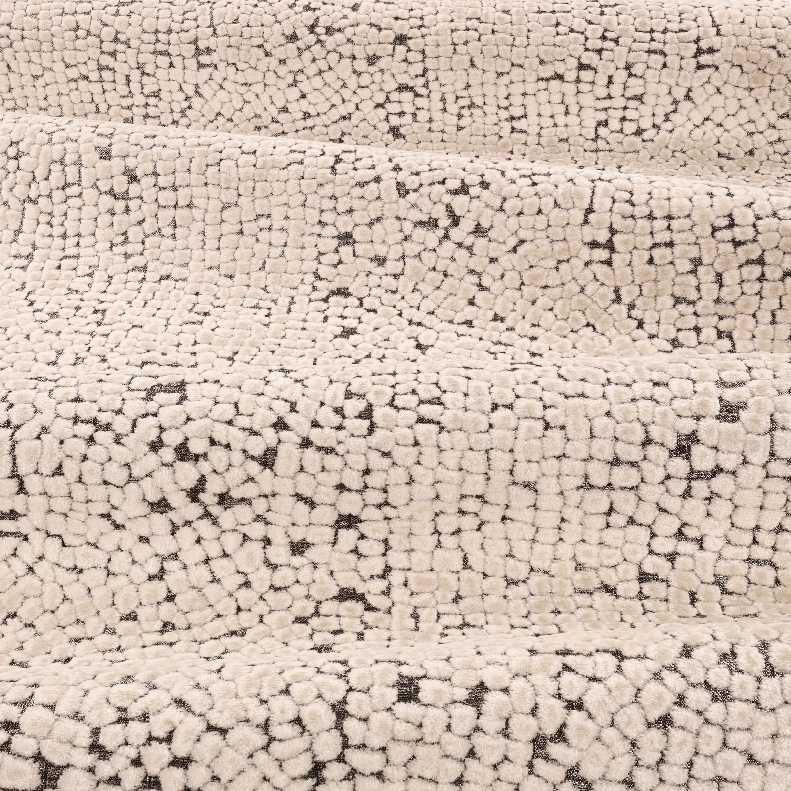 Warm ivory looped upholstery fabric with scattered charcoal flecks and nubby texture