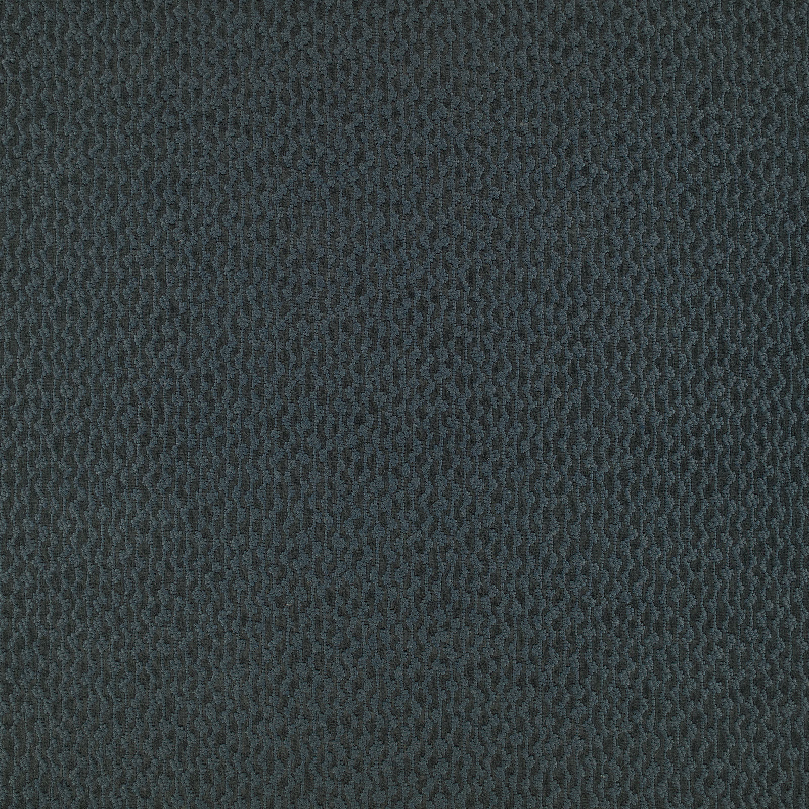 Close-up of dark charcoal-teal fabric with a compact vertical wave texture