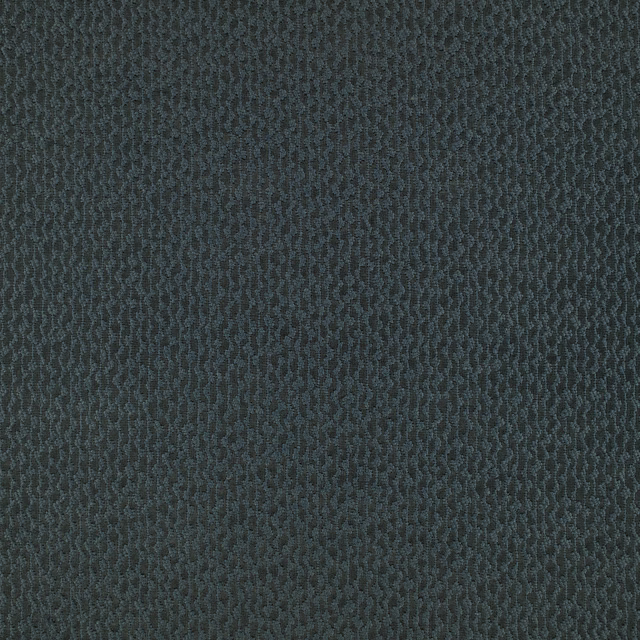 Close-up of dark charcoal-teal fabric with a compact vertical wave texture