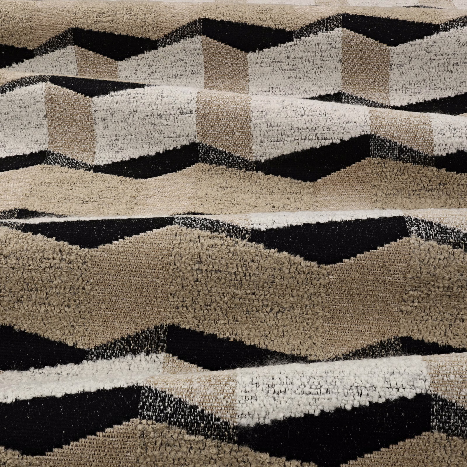 Nubby taupe upholstery with irregular cream and black horizontal geometric bands