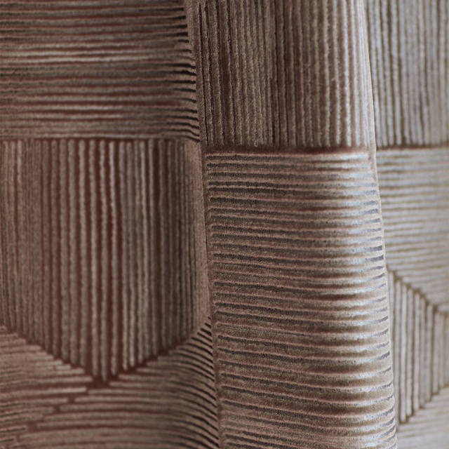 Muted mauve-taupe geometric fabric with raised directional ribs and pale greige highlights