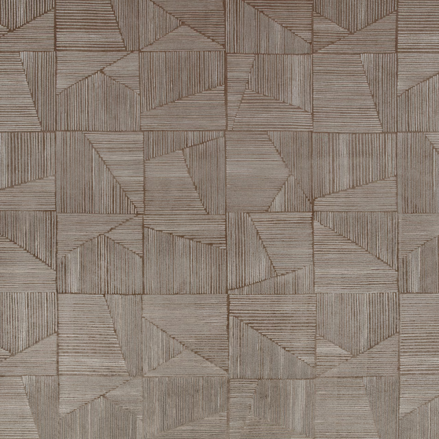 Warm taupe-grey fabric with angular patchwork blocks and fine directional ribbed lines