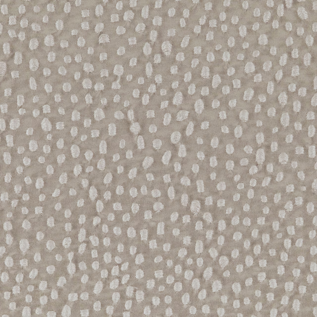 Soft taupe woven ground with irregular raised ivory flecks and tactile texture
