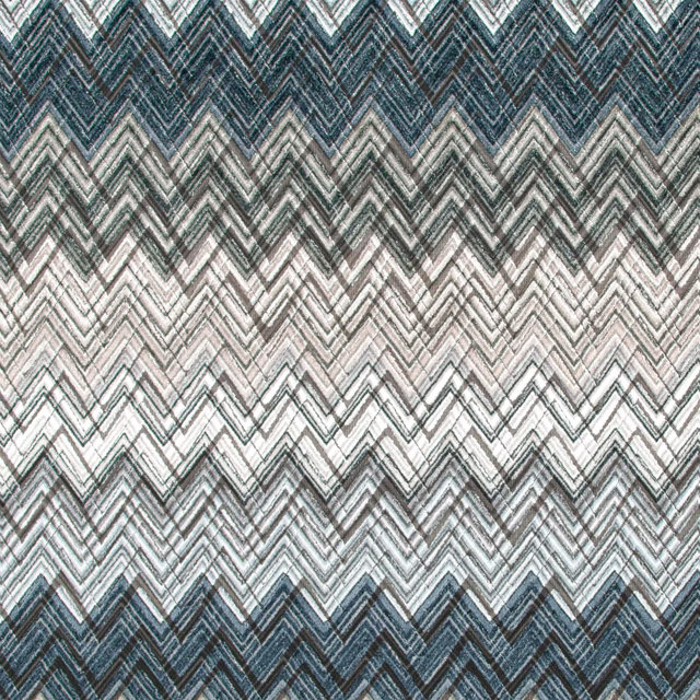 Storm-blue and charcoal chevron textile with pale stone zigzag bands