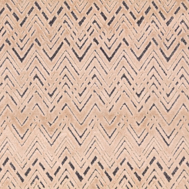 Warm shell woven fabric with broken charcoal chevrons and tactile textured surface