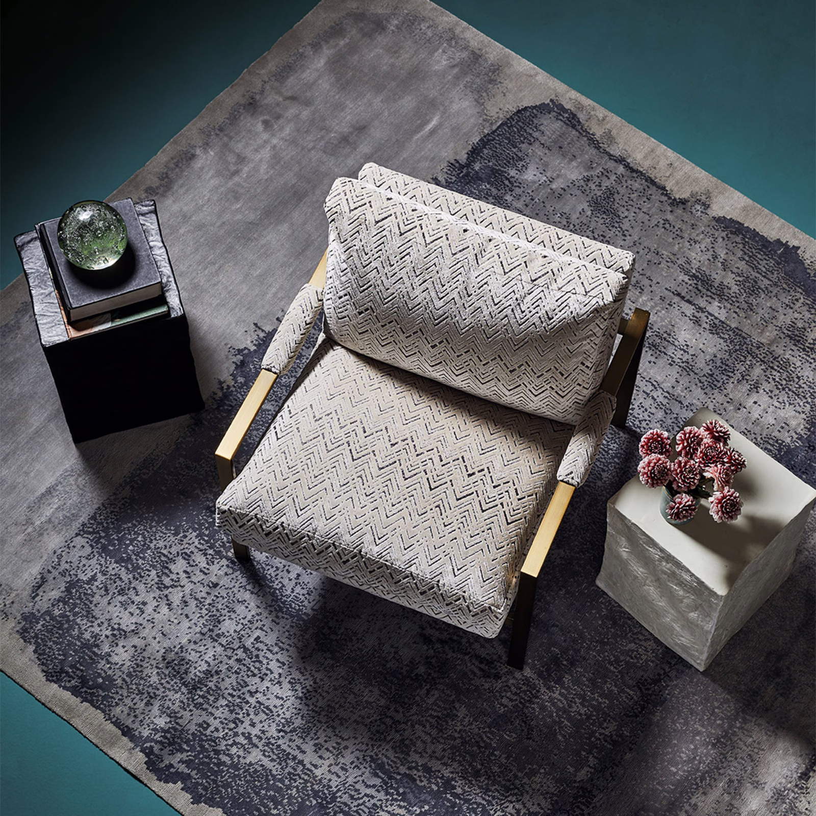 Pale silver-grey chair upholstery with fine charcoal chevrons and an ivory woven ground