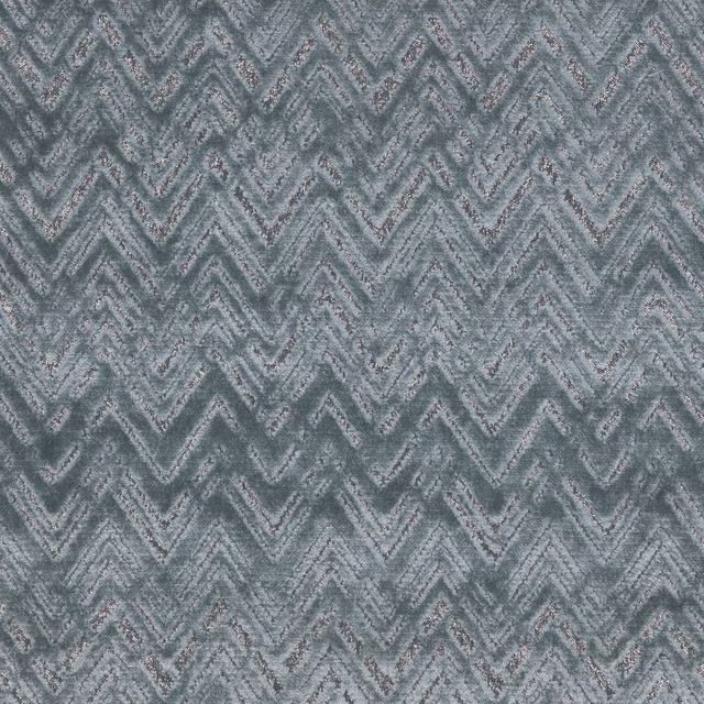 Cool blue-grey textile with mottled woven chevrons and softly broken zigzag texture