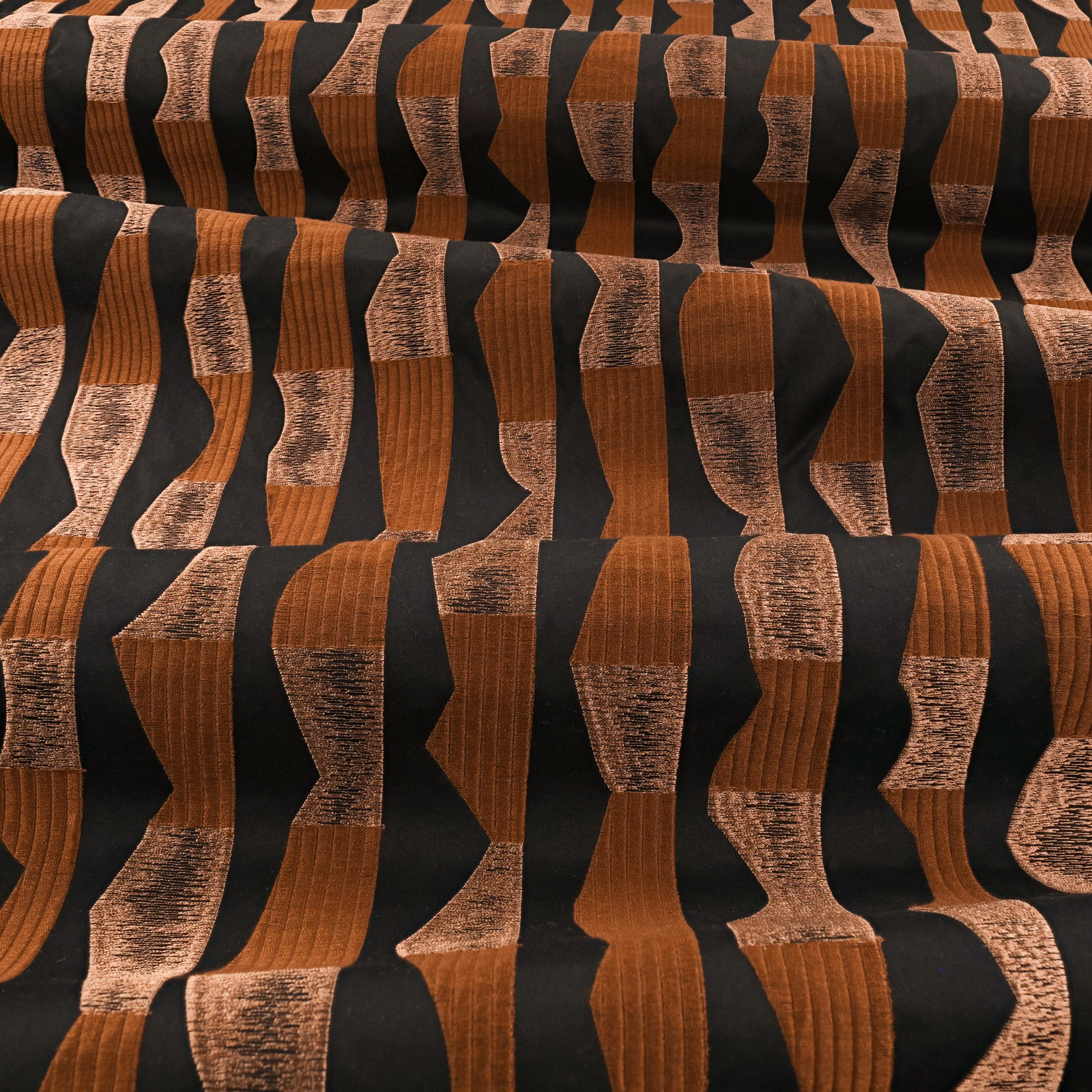 Burnt-copper and black irregular vertical bands with varied raised woven texture