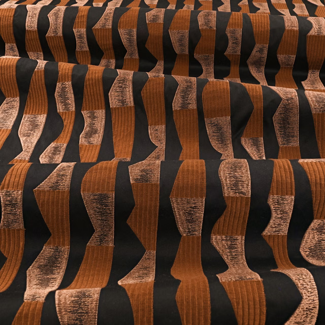 Burnt-copper and black irregular vertical bands with varied raised woven texture