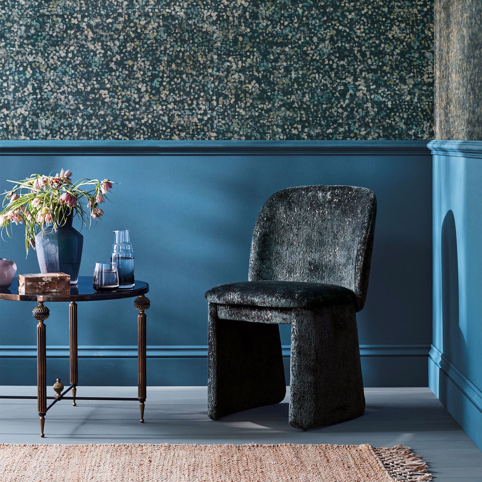 Deep blue-teal wallpaper with dense cream and grey flecks across a dark ground