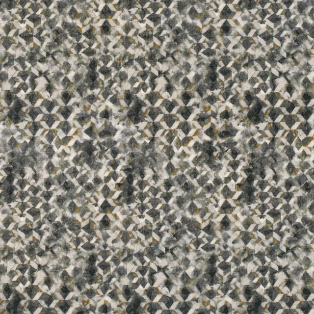 Charcoal and cream geometric fabric with mottled grey texture and oxide flecks