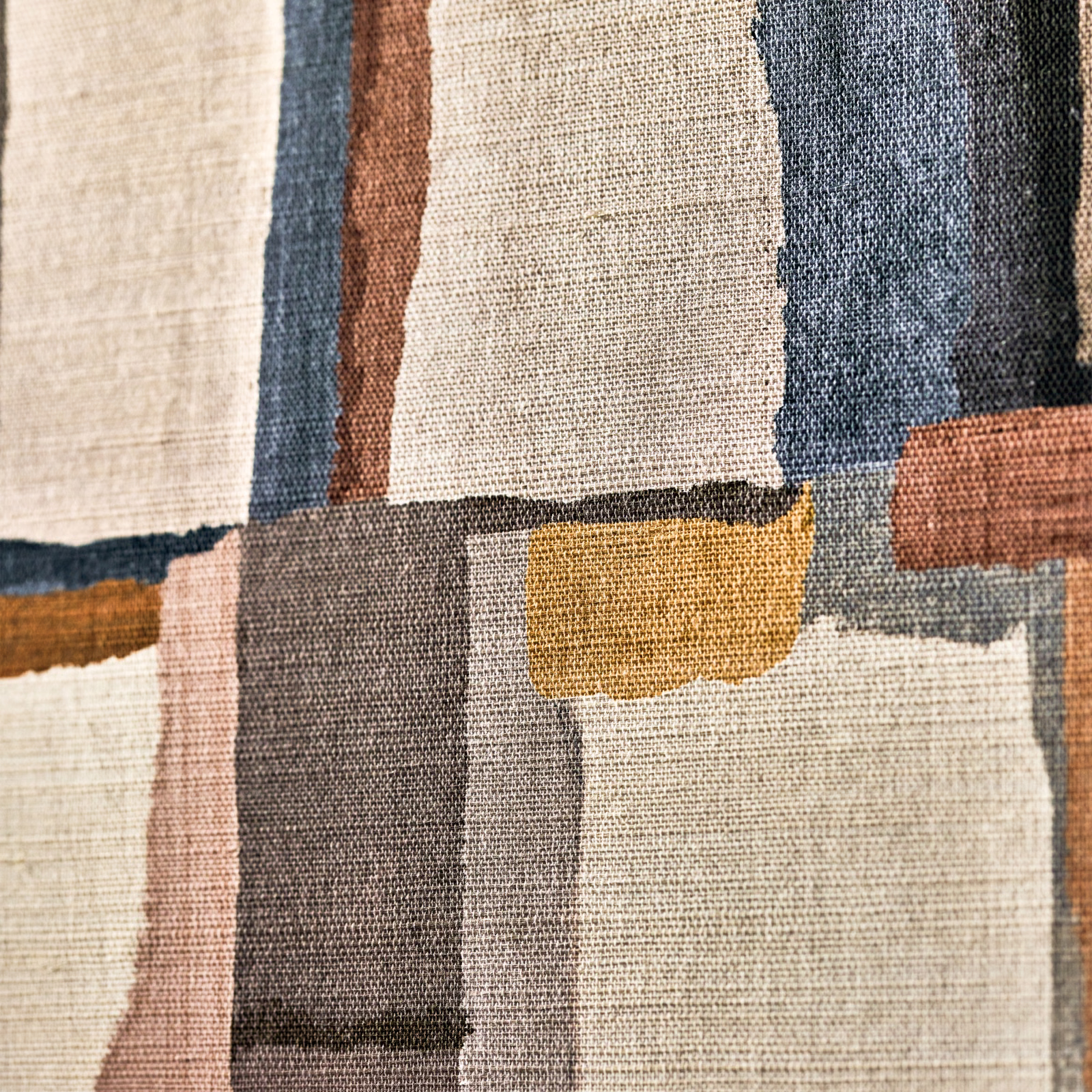 Sienna, navy and cream geometric blocks with ochre accents and a crosshatched surface