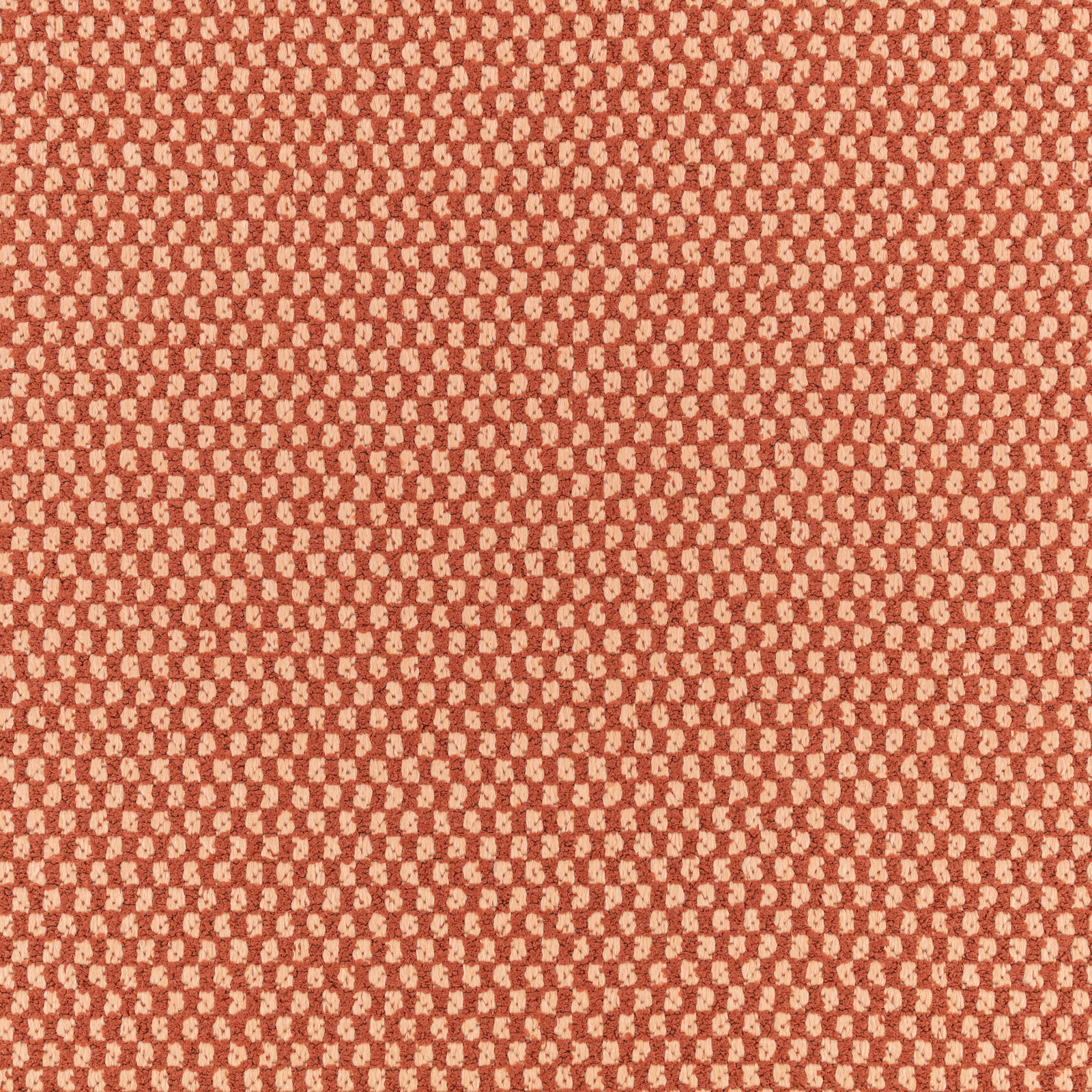 Warm henna-red outdoor weave with dense cream pebble-like flecks and tactile texture