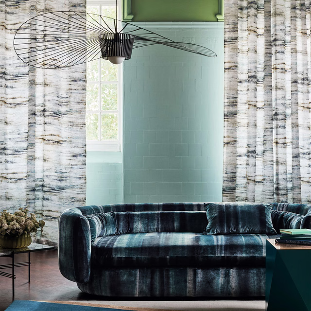 Deep indigo upholstery with pale blue-grey vertical striations and a plush surface