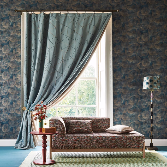 Cool blue-grey curtain with fine angular lines and a softly lustrous fall
