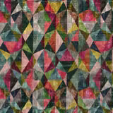 Matiko Multi fabric showing jewel-toned triangles, teal, magenta, mustard and mottled neutrals