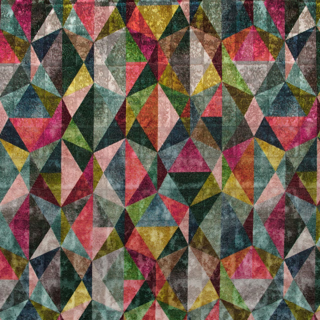 Matiko Multi fabric showing jewel-toned triangles, teal, magenta, mustard and mottled neutrals