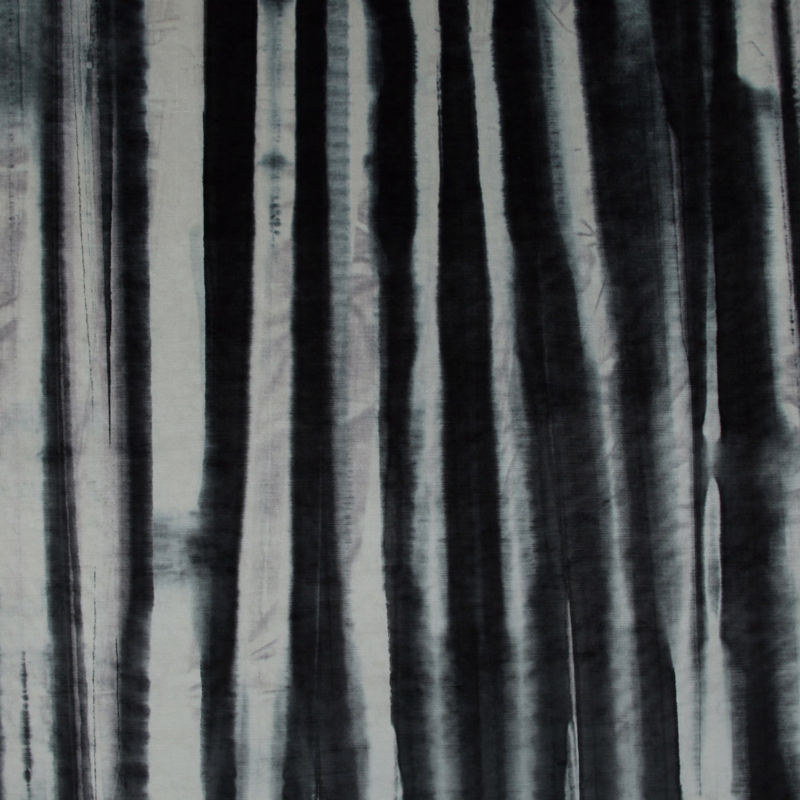 Cool charcoal fabric with irregular black and pale grey vertical painterly stripes
