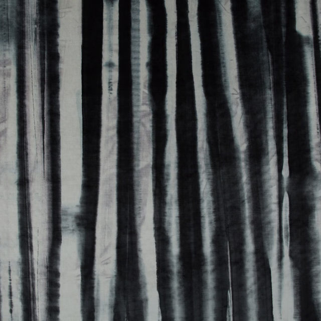 Cool charcoal fabric with irregular black and pale grey vertical painterly stripes