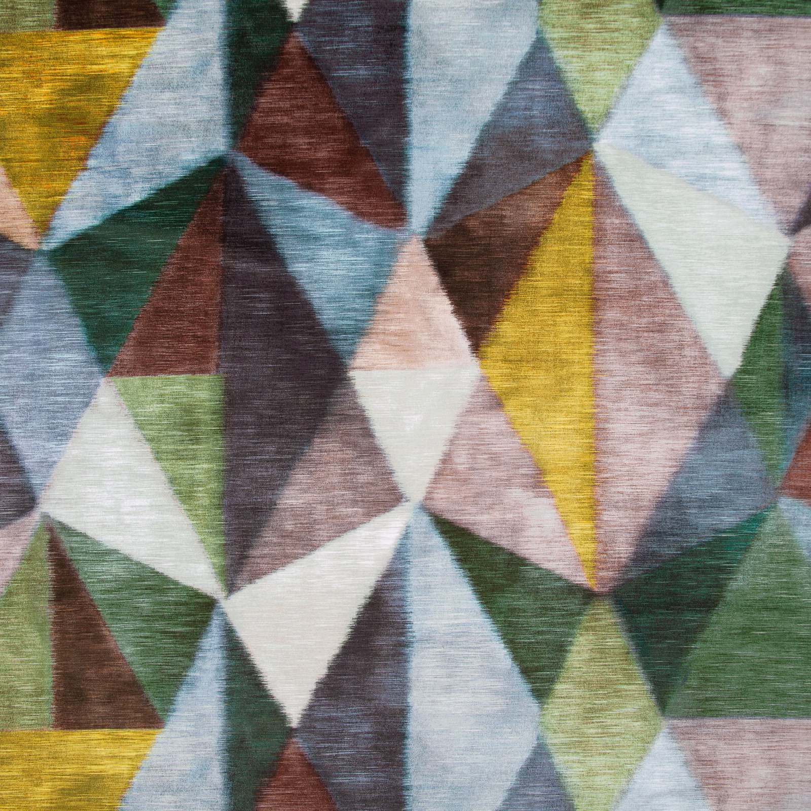 Multicoloured geometric woven fabric with blue, mustard, green and blush angular facets