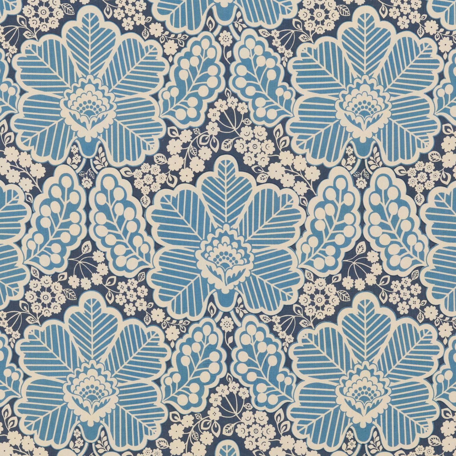 Arbour Indigo cotton showing oversized pale blue and cream floral motifs on indigo