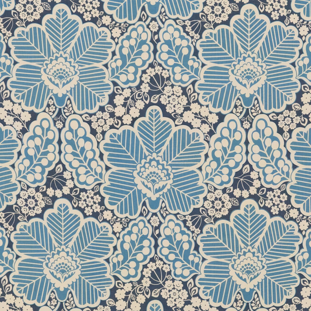 Arbour Indigo cotton showing oversized pale blue and cream floral motifs on indigo