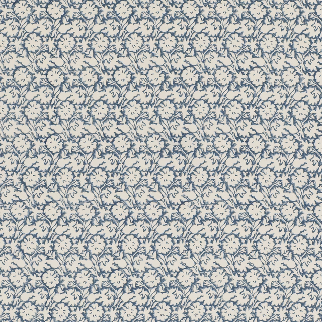 Dense muted indigo flowers and leafy sprigs on a warm cream cotton ground