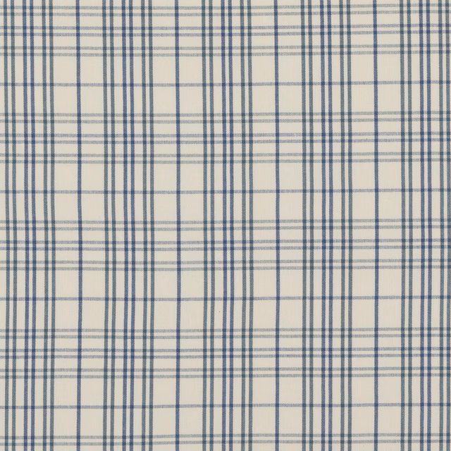 Cream cotton ground crossed by muted blue lines in a layered check