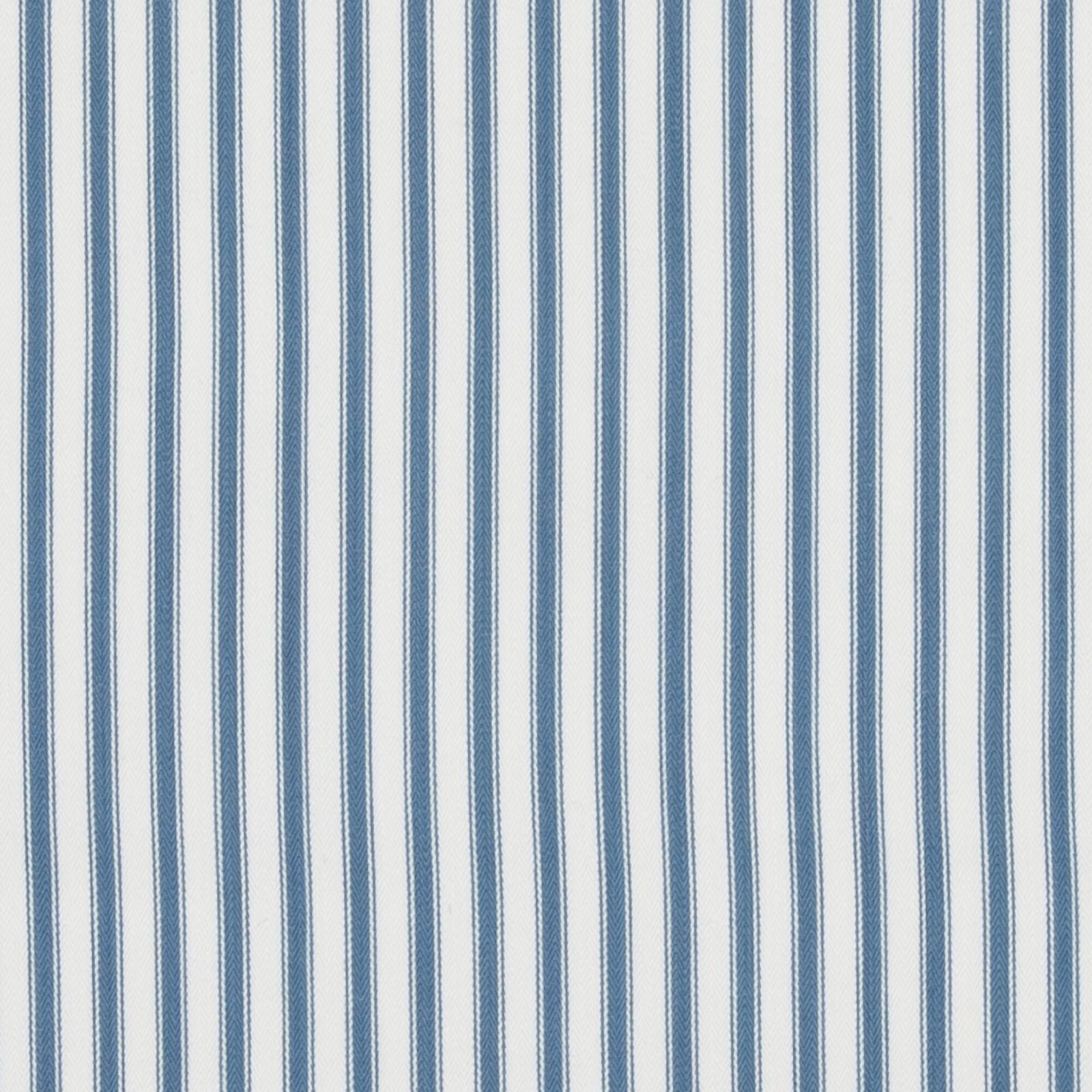 Close view of muted blue and cream narrow vertical cotton ticking stripes