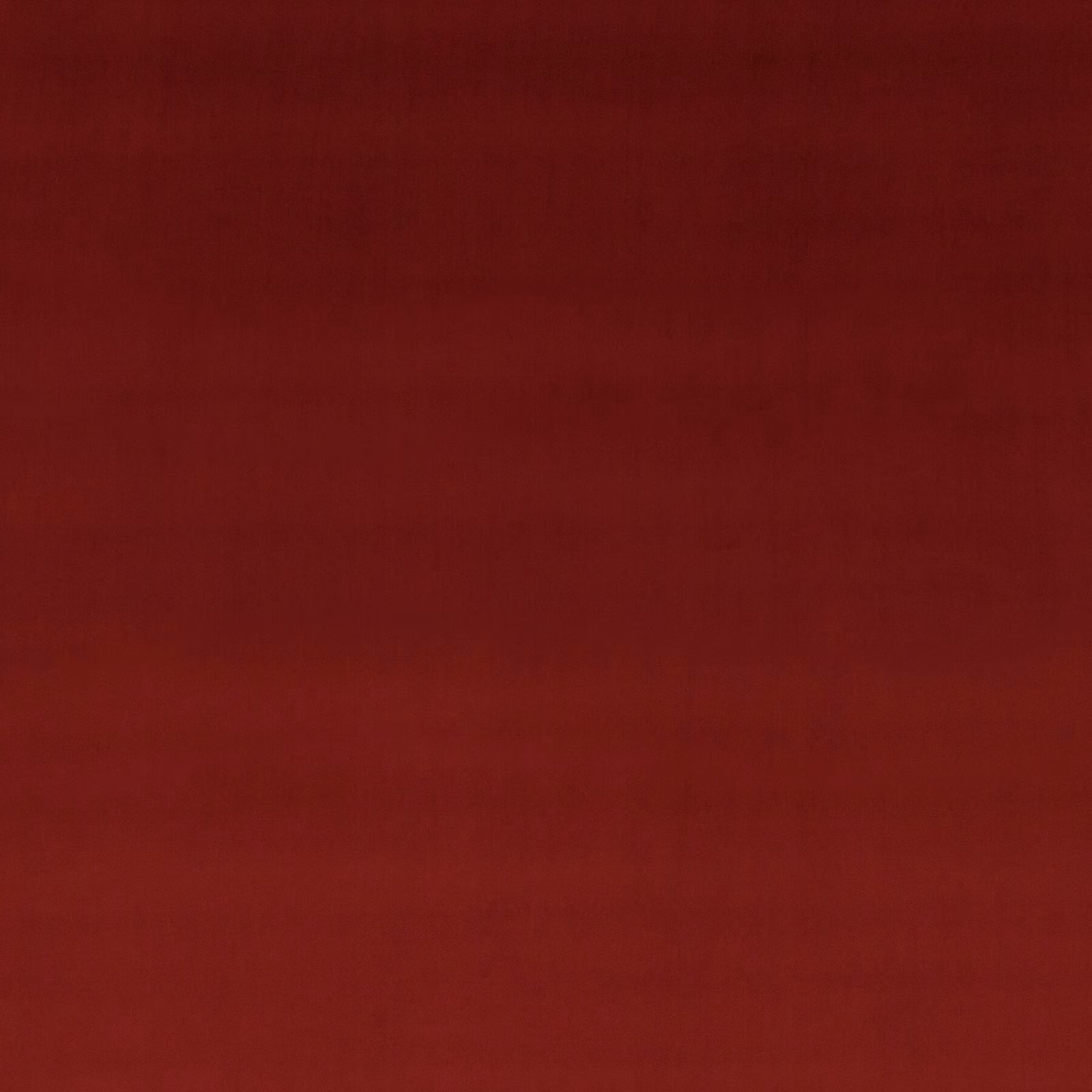 Deep cranberry red velvet swatch showing smooth pile and subtle tonal shading