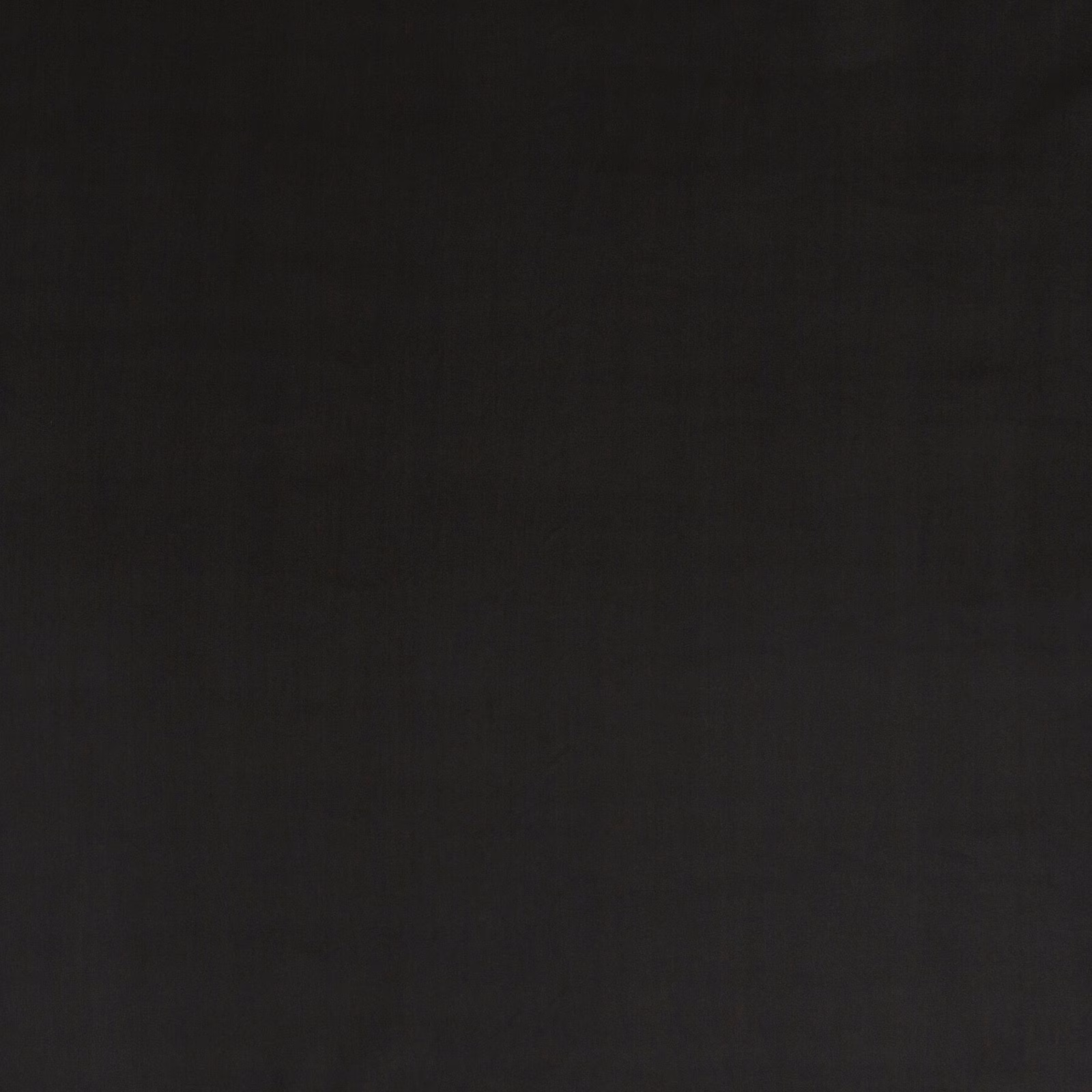 Near-black ebony velvet with a soft directional nap and subtle tonal sheen
