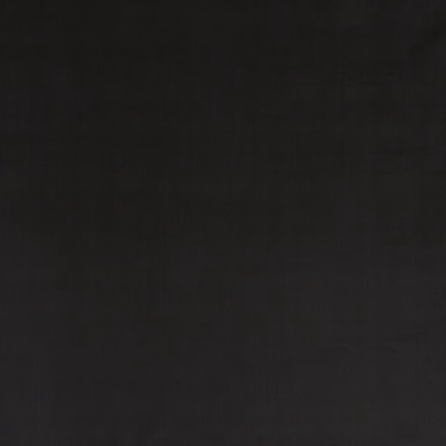 Near-black ebony velvet with a soft directional nap and subtle tonal sheen